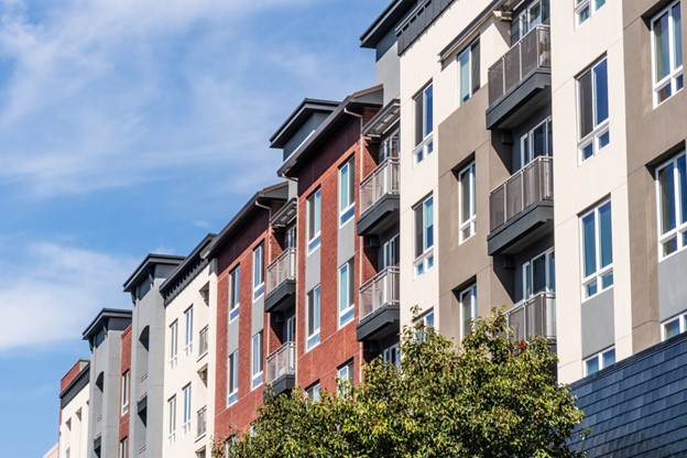 Cropped street view looking up at an apartment or condo complex