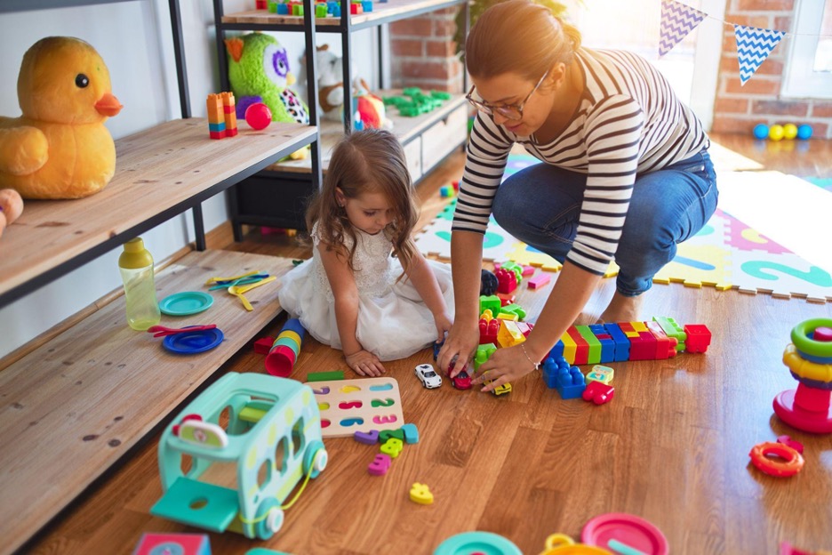 A mom and a kid playing with toys