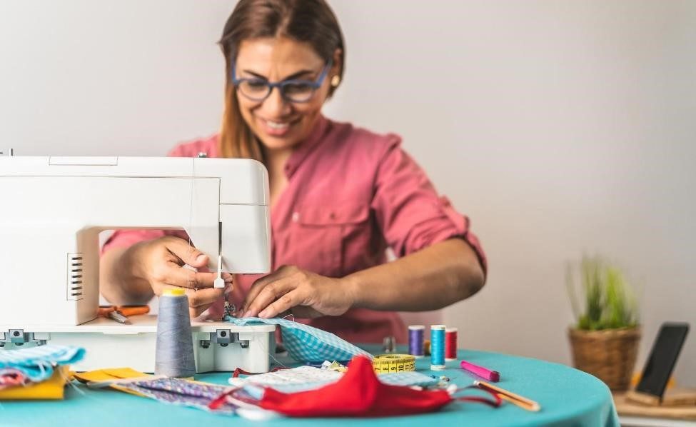 A woman using a sewing machine